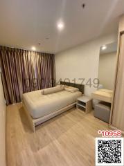 Modern furnished bedroom with laminated flooring