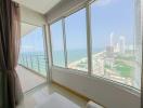 Bright bedroom with large windows and ocean view