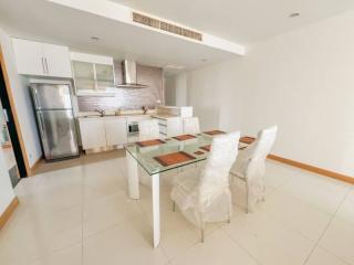 Modern kitchen with dining area and stainless steel appliances