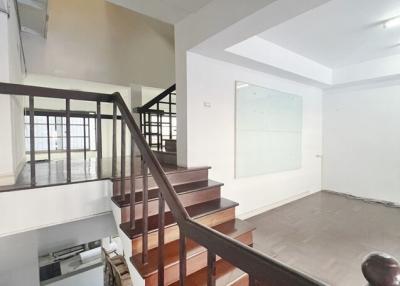 Interior view of a two-story living space with staircase