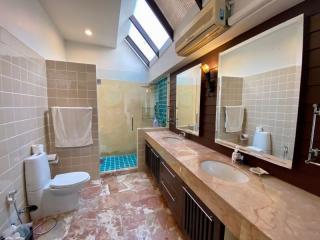 Spacious bathroom with natural light and modern amenities