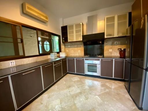 Modern kitchen with stainless steel appliances and granite countertops