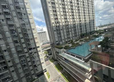 High-rise residential buildings with swimming pool and garden area