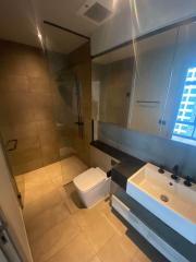 Modern bathroom interior with glass shower area