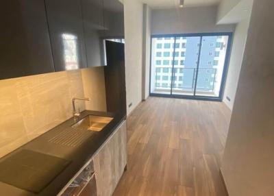 Modern kitchen with wooden floor and natural light