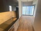 Modern kitchen with wooden floor and natural light