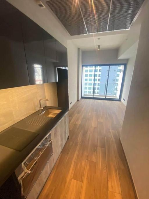 Modern kitchen with wooden floor and natural light