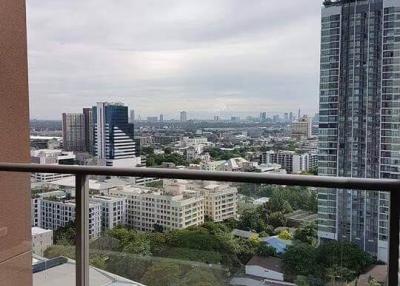 View from the balcony overlooking the city skyline and greenery