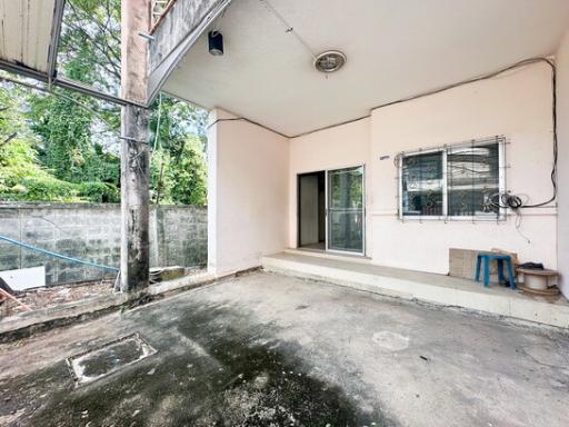 Spacious outdoor patio area with concrete floor