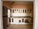 Spacious kitchen with ample cabinetry and natural light