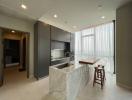 Modern kitchen with marble island and panoramic window view