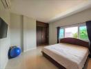 Spacious airy bedroom with large bed and modern amenities