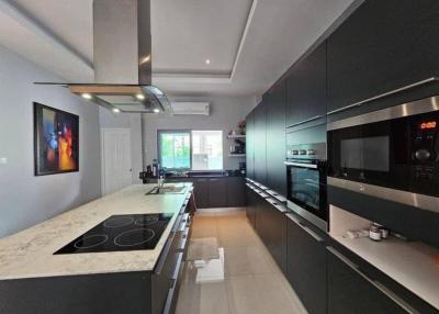 Modern kitchen with stainless steel appliances and granite countertops