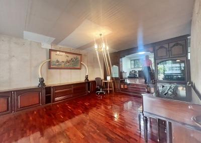 Spacious living room with wooden floors and classic decor