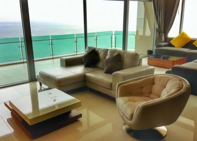 Spacious living room with modern furniture and ocean view