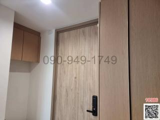Modern wooden entrance door with digital lock in a residential home