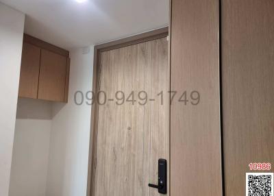 Modern wooden entrance door with digital lock in a residential home