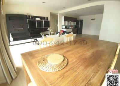 Modern kitchen with dining area and elegant black shelving