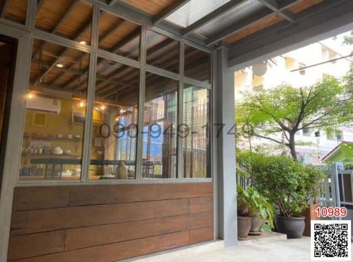 Cozy patio area with sliding glass doors and wooden accents