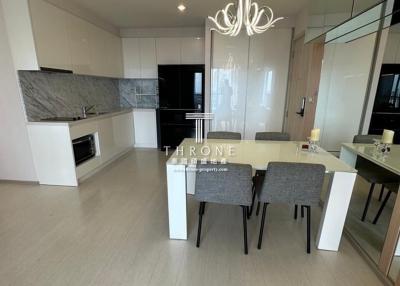 Modern kitchen with attached dining area in a bright apartment