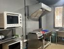 Compact commercial-style kitchen with stainless steel appliances