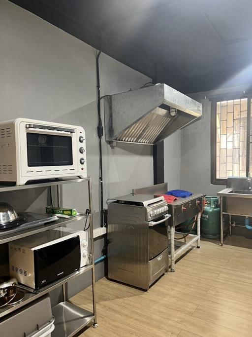 Compact commercial-style kitchen with stainless steel appliances