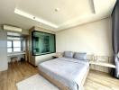 Modern bedroom with en-suite bathroom and ample lighting