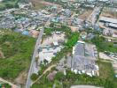 Aerial view of a residential area with clear property boundaries and surrounding environment