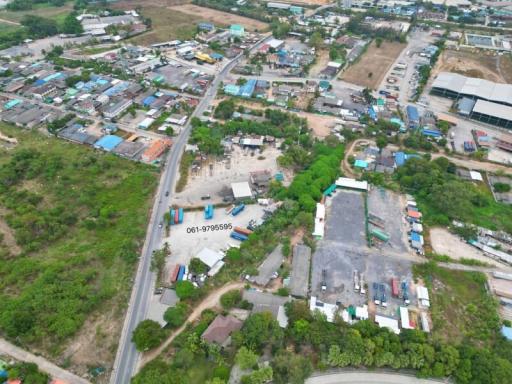 Aerial view of a residential area with clear property boundaries and surrounding environment