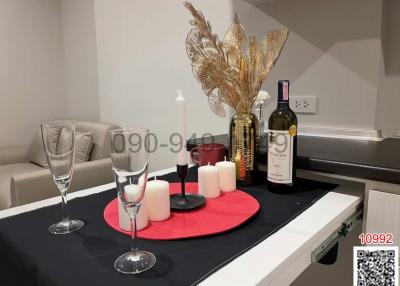 Modern kitchen with a dining setup including wine and elegant decor