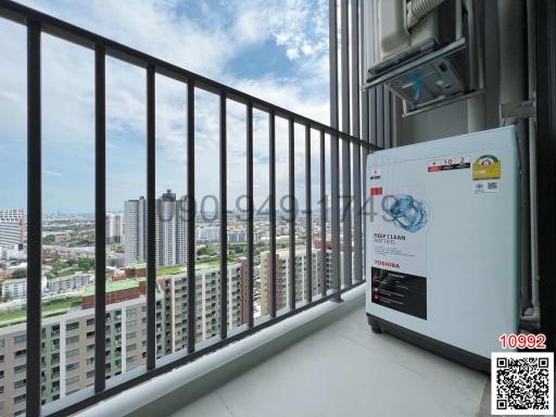 Balcony with city view and air conditioning unit