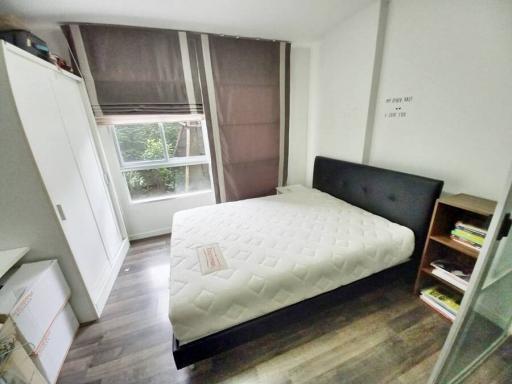 Cozy bedroom with natural light and modern furnishing