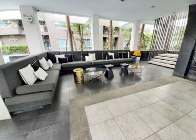 Spacious and modern living room with large sectional sofa