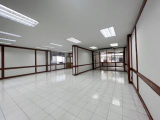 Spacious open-plan commercial interior with bright lighting
