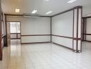 Spacious and well-lit commercial interior with tiled floors