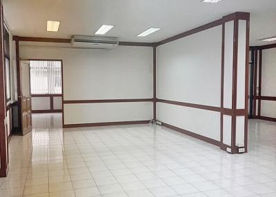 Spacious and well-lit commercial interior with tiled floors