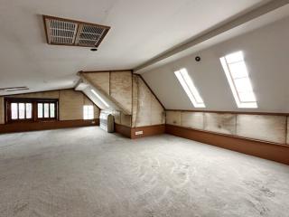 Spacious converted attic room with natural light