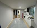 Modern kitchen with open plan layout extending to a laundry area