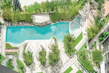 Aerial view of outdoor swimming pool and garden in residential complex