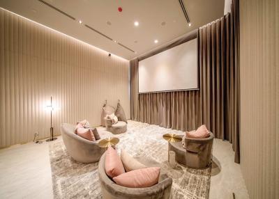 Modern home theater with comfortable seating and large projection screen
