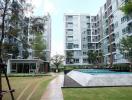 Modern apartment building with garden and swimming pool