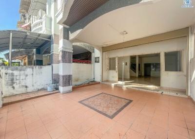 Spacious patio area with tiled flooring and open entrance