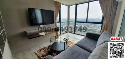 Contemporary living room with expansive city views