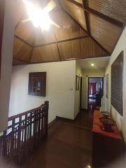 Elegant hallway with wooden floors and ceiling