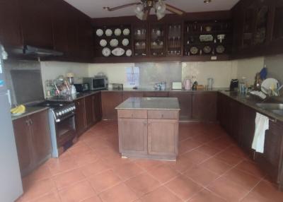 Spacious kitchen with central island and modern appliances