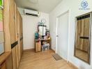 Cozy bedroom interior with wooden furniture and air-conditioning