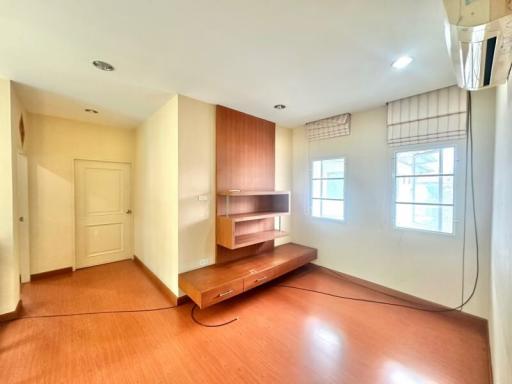 Bright and spacious living room with wooden flooring