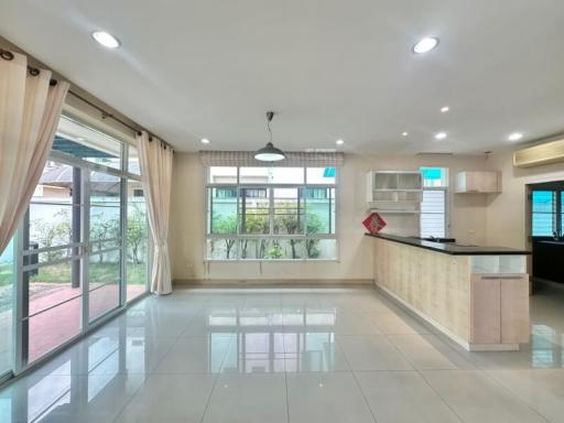 Modern kitchen with open plan design, leading to the garden