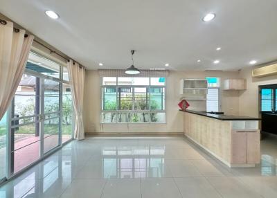 Modern kitchen with open plan design, leading to the garden