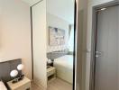 Modern bedroom with mirrored sliding closet doors and elegant decor